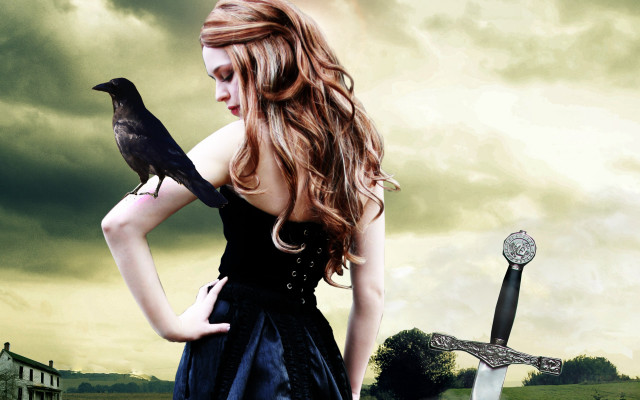 Woman black dress holding bird free wallpaper - medium preview image