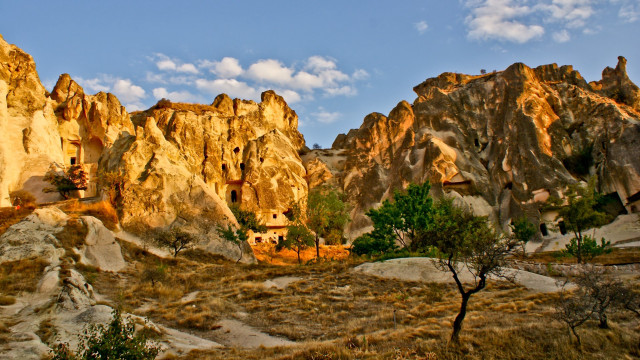 Rocky landscape house trees mountains free wallpaper - medium preview image