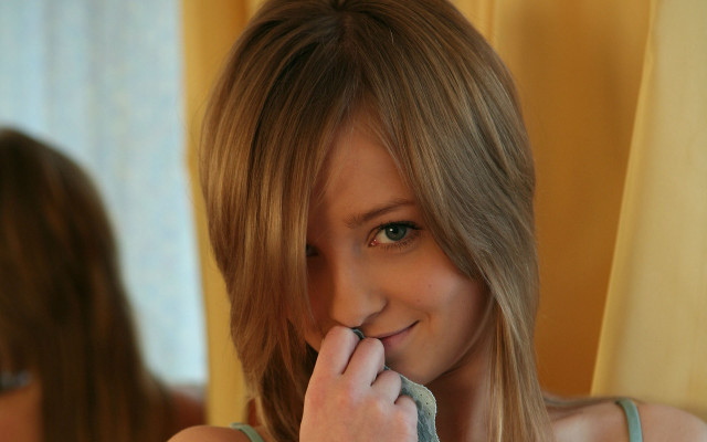 Woman brushing teeth blurry mirror free wallpaper - medium preview image