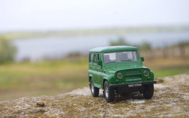 Green toy truck rock water free wallpaper - medium preview image