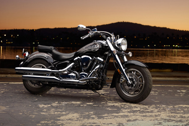 Motorcycle parked road water night free wallpaper - medium preview image