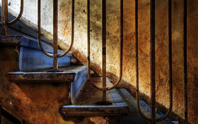 Rundown stairs bars rusted walls free wallpaper - medium preview image