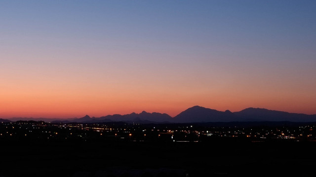 City skyline mountains sunset clouds free wallpaper - medium preview image