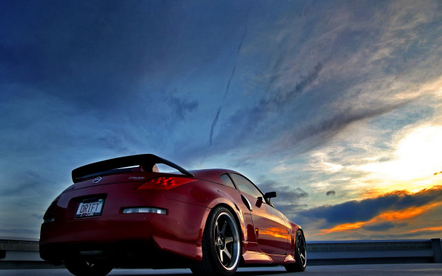 Red sports car cloudy sky #21 free wallpaper - medium preview image
