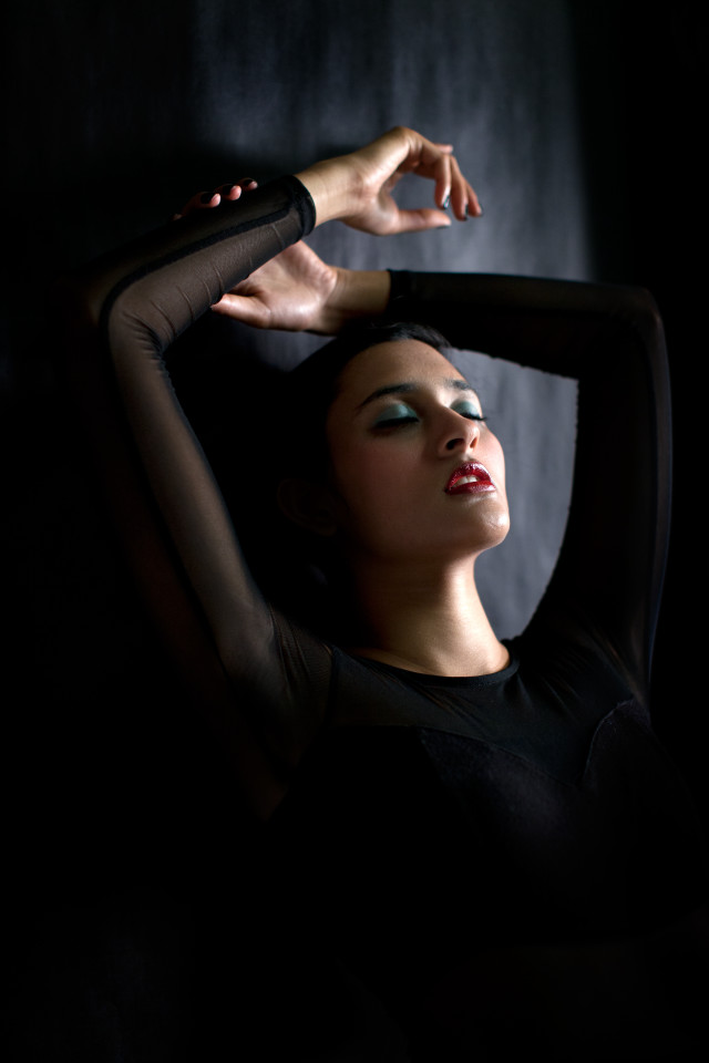 Woman hands head arm behind free wallpaper - medium preview image