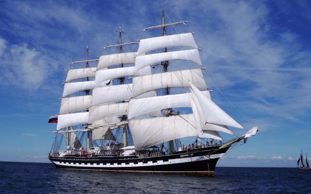 Sailboat ocean blue sky clouds free wallpaper - medium preview image