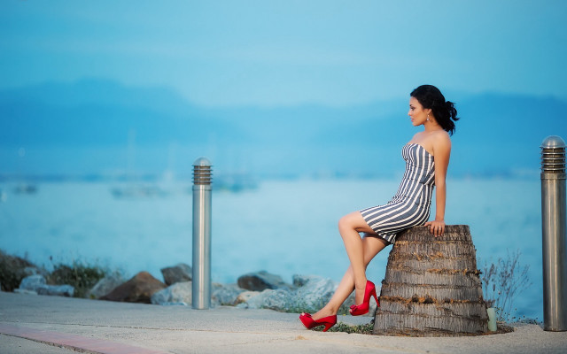 Woman sitting by water striped free wallpaper - medium preview image