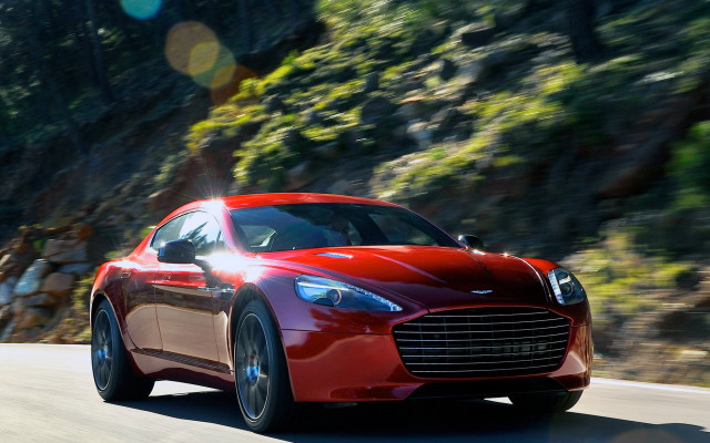 Red car mountain road sunflare free wallpaper - medium preview image
