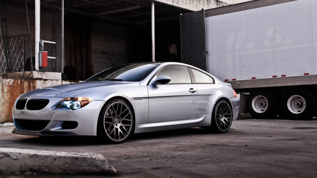 Silver car truck parking lot free wallpaper - medium preview image