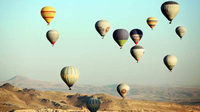 Hot air balloons mountains sky free wallpaper - medium preview image