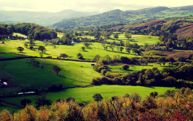 Green valley houses mountains clouds free wallpaper - medium preview image