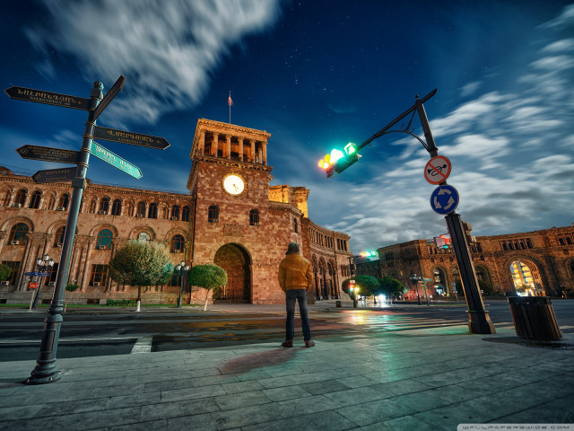 Man standing building clock tower free wallpaper - medium preview image
