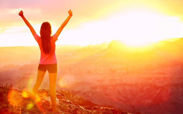 Mountain sunset woman arms raised free wallpaper - medium preview image