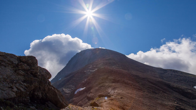 Mountain sun clouds rocks beach free wallpaper - medium preview image