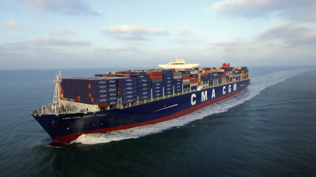 Cargo ship ocean sunny clouds free wallpaper - medium preview image