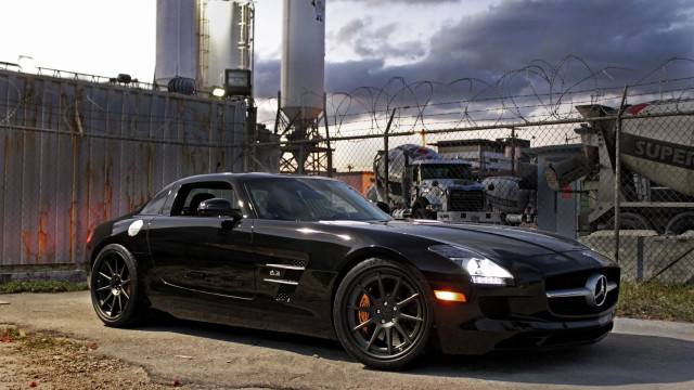 Black sports car fence truck free wallpaper - medium preview image