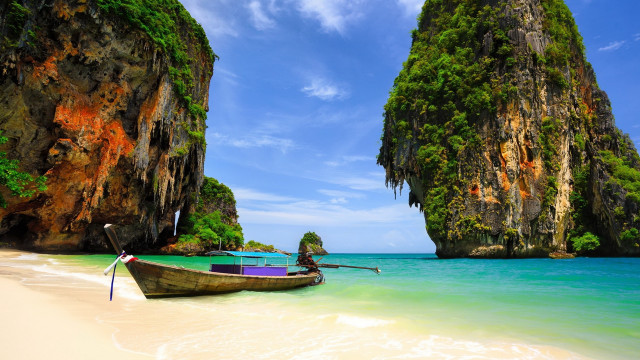 Beach cliffs water boat sky free wallpaper - medium preview image