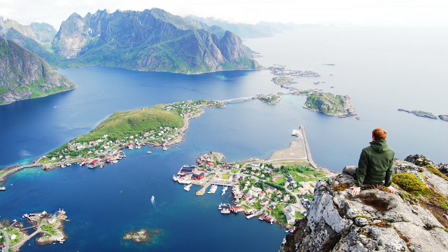 Cliff overlooking water town scenery free wallpaper for desktop - medium preview image