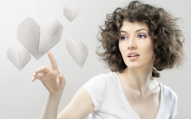 Woman pointing heart mobile curly free wallpaper - medium preview image