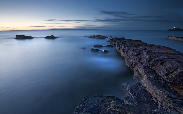 Lighthouse rocks water mountains clouds free wallpaper - medium preview image