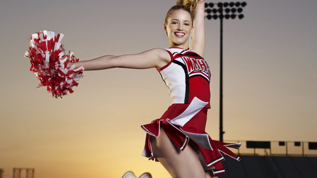 Cheerleader pom poms posing smile free wallpaper - medium preview image