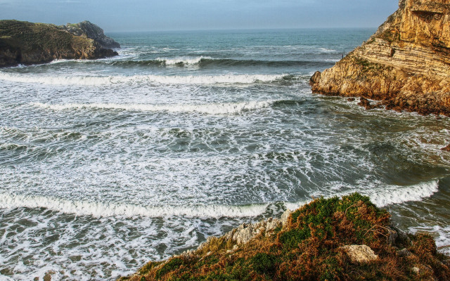 Wave riders beach cliff ocean free wallpaper - medium preview image