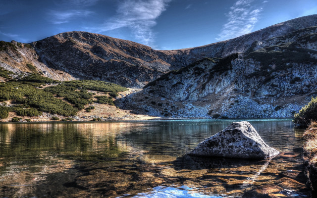 Lake mountains rock shore clouds free wallpaper - medium preview image