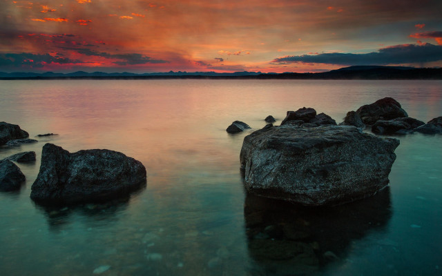 Sunset lake rocks clouds horizon free wallpaper - medium preview image