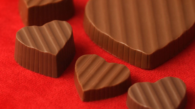 Heart shape chocolates red background free wallpaper - medium preview image