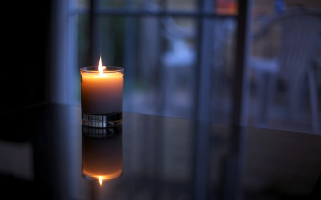 Lit candle table window reflection free wallpaper - medium preview image