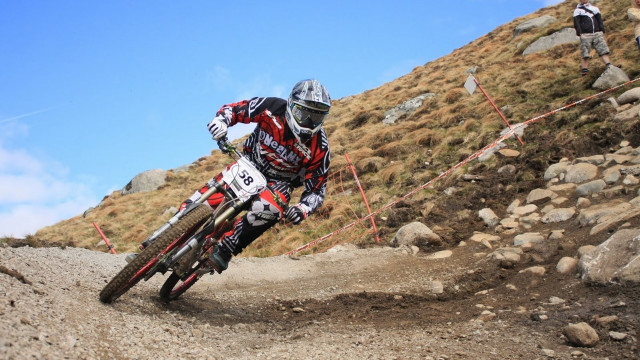 Dirt bike hill rocks grass free wallpaper - medium preview image