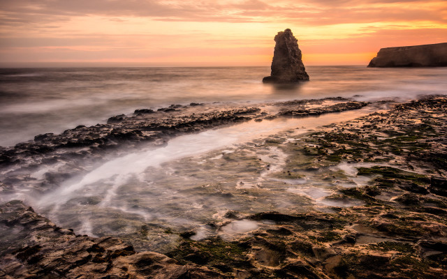 Ocean rock formation sunset beach free wallpaper - medium preview image