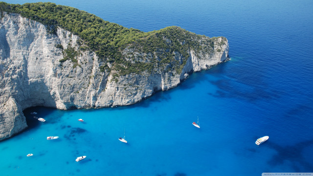 Boats cliff ocean water group free wallpaper - medium preview image