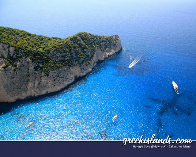 Boat rocky island water image free wallpaper - medium preview image