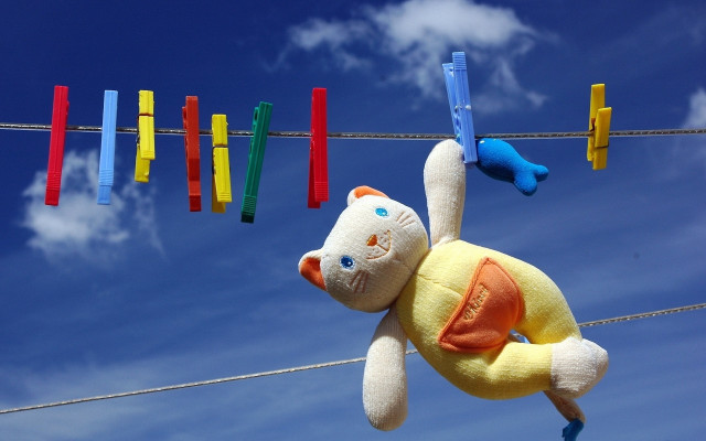 Stuffed animal clothesline blue sky free wallpaper - medium preview image
