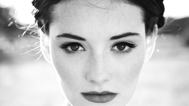 Freckled hair tie serious black free wallpaper - medium preview image