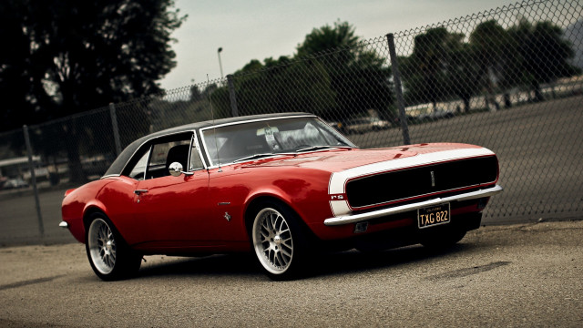 Red car fence city vehicle free wallpaper for desktop - medium preview image