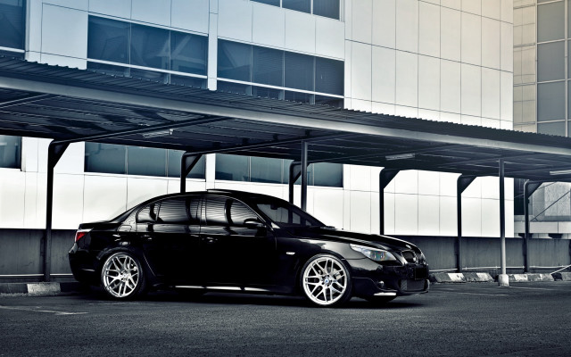 Black car parking lot building #2 free wallpaper - medium preview image