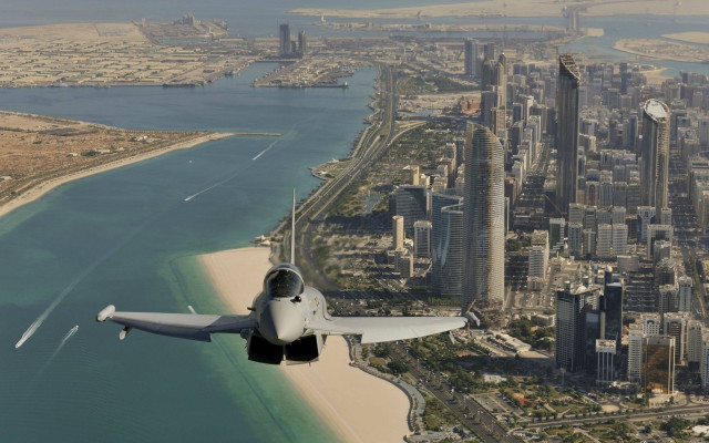 City beach ocean plane sky free wallpaper - medium preview image
