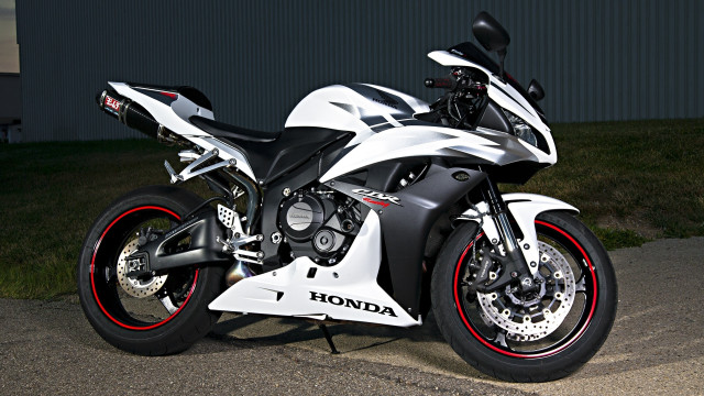 Motorcycle parked street building grass free wallpaper - medium preview image