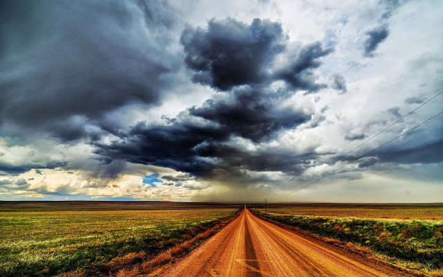 Stormy sky clouds over grassy free wallpaper - medium preview image
