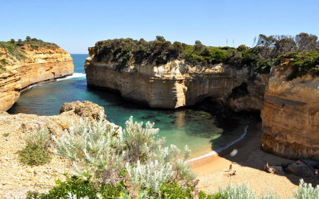 Beach cliff water person matte free wallpaper - medium preview image