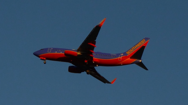Red blue airplane sky clouds free wallpaper - medium preview image