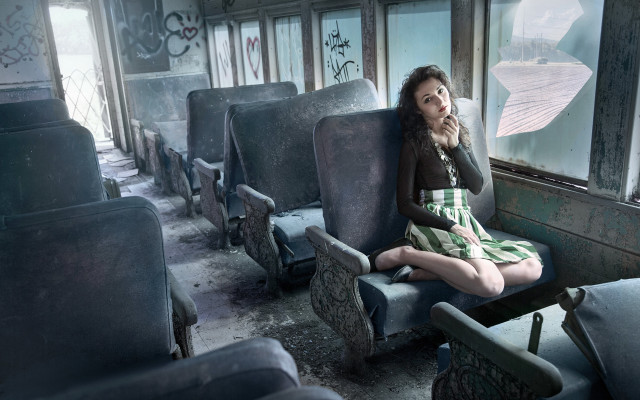 Woman sitting train seat handbag free wallpaper - medium preview image