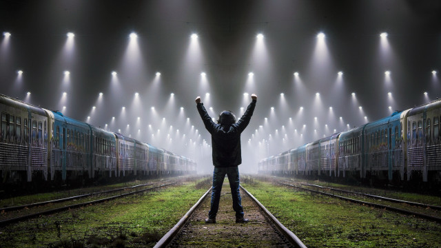 Man stand train track cityscape free wallpaper - medium preview image