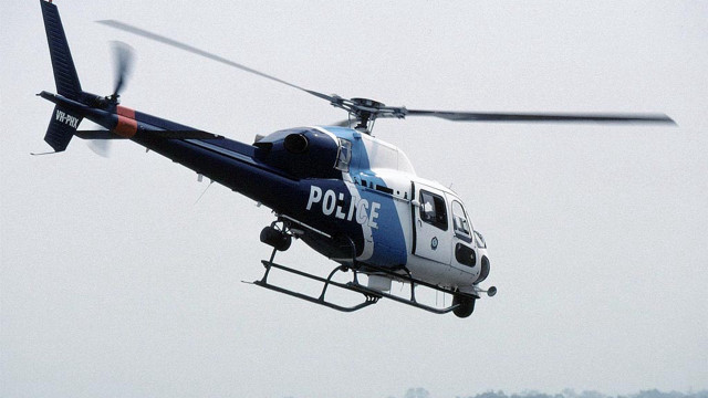 Police helicopter landing gear person free wallpaper - medium preview image