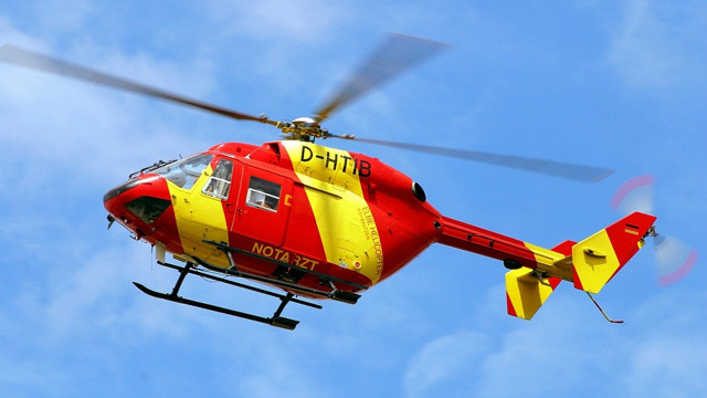 Red yellow helicopter blue sky free wallpaper - medium preview image