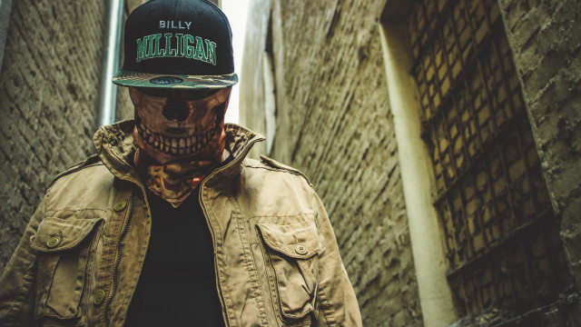 Skull facepaint baseballcap alleyway brickwall free wallpaper - medium preview image