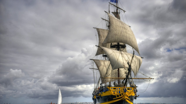 White sailboat yellow sail ocean free wallpaper - medium preview image