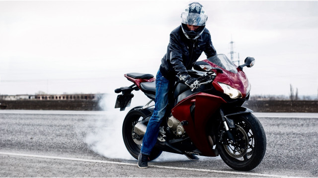 Man riding red motorcycle field free wallpaper - medium preview image